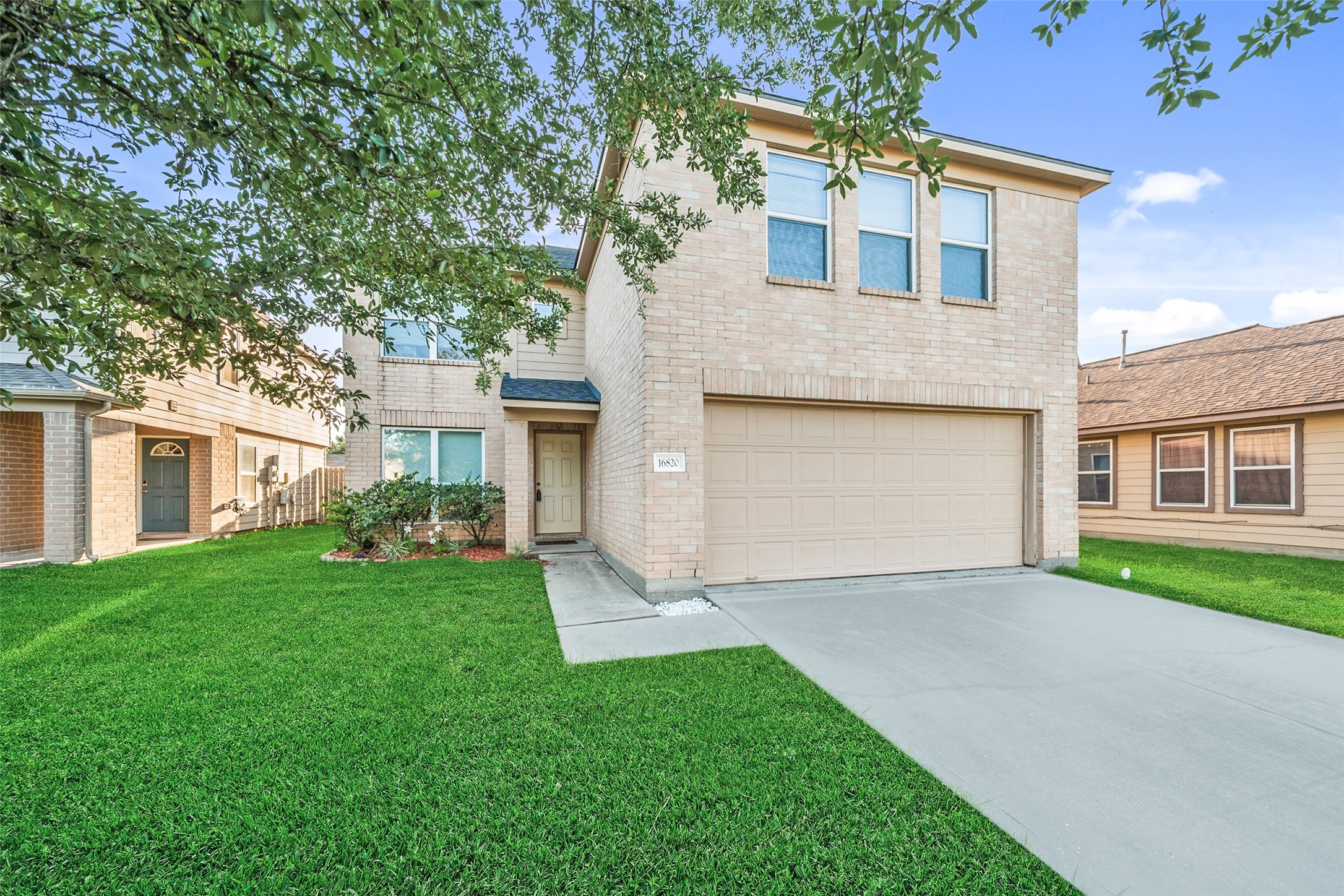 16820 Infield Court Conroe, TX 77385 - Photo 4 of 44 a front view of a house with a garden and yard
