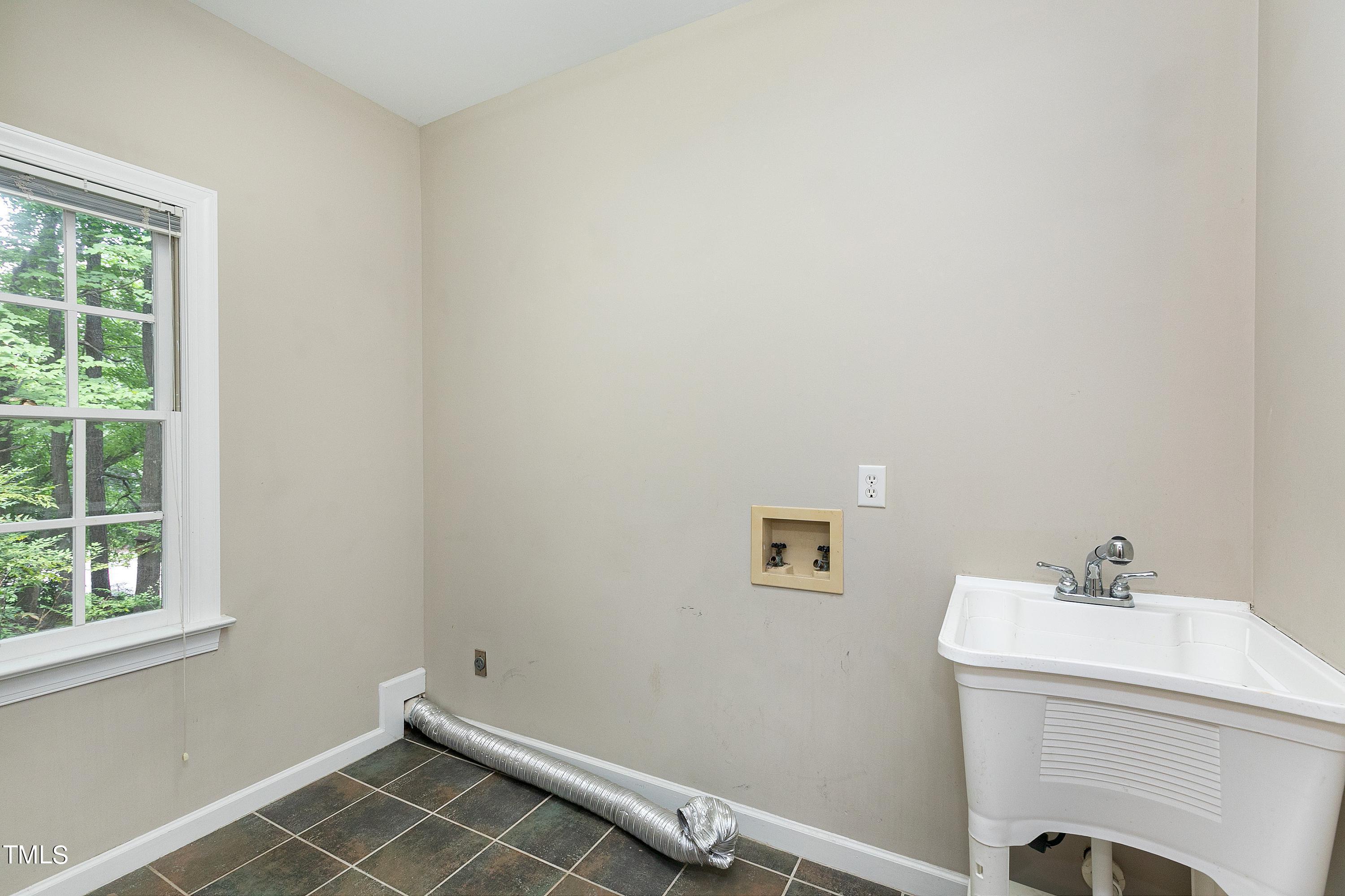 100 Buckden Place Cary, NC 27518 - Photo 20 of 70 a bathroom with a sink and a vanity