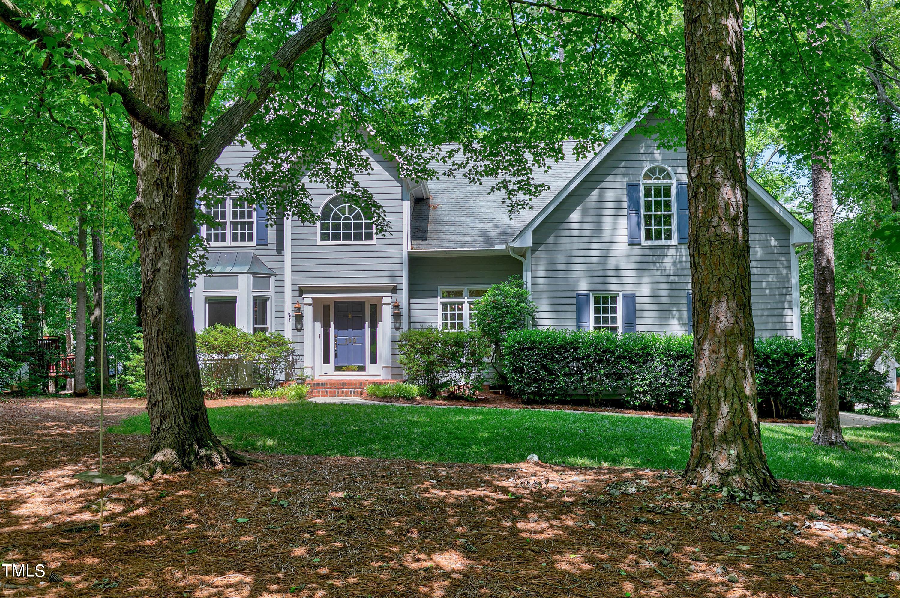 100 Buckden Place Cary, NC 27518 - Photo 2 of 70 a front view of a house with a yard