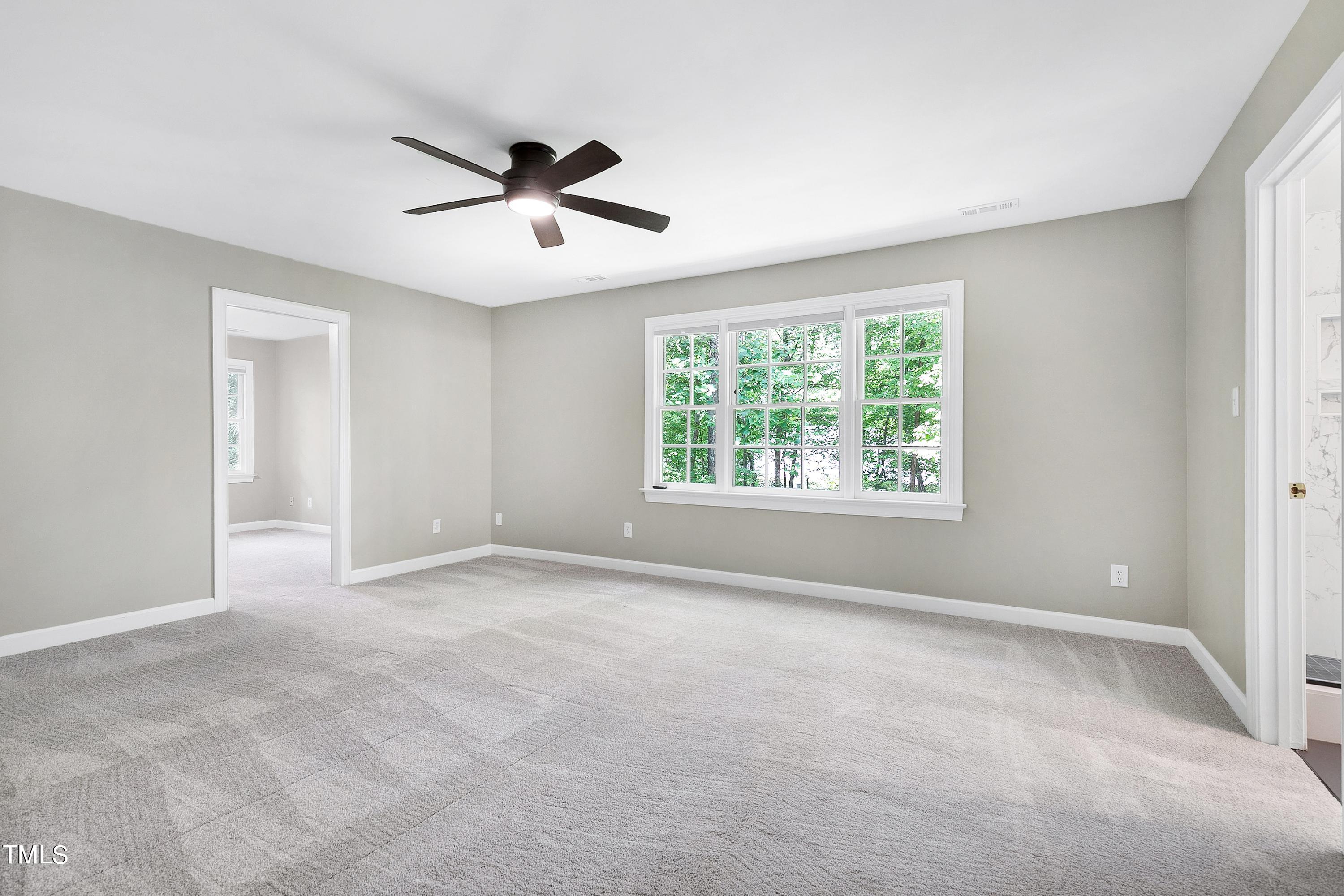100 Buckden Place Cary, NC 27518 - Photo 25 of 70 a view of an empty room with a window