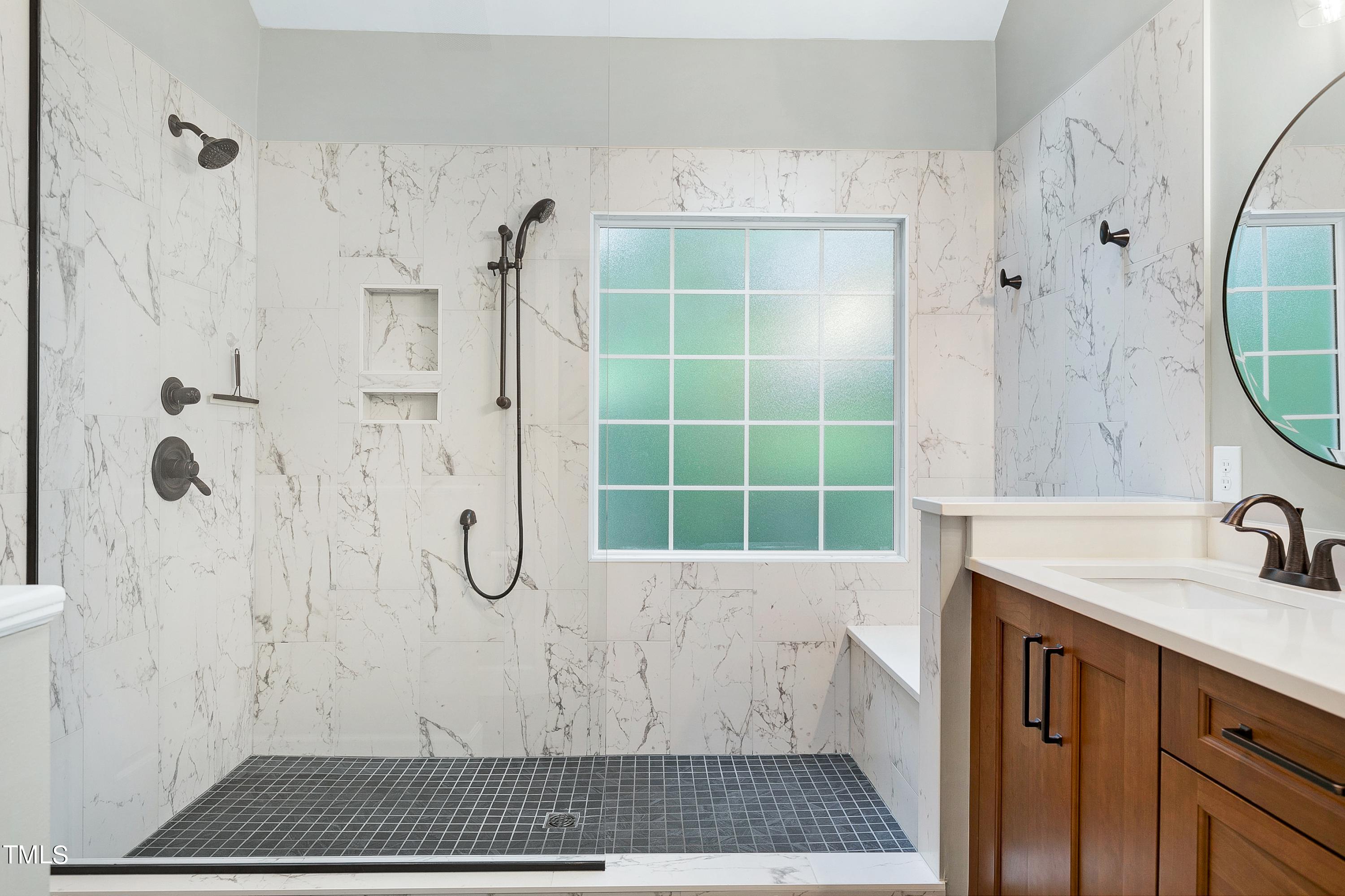 100 Buckden Place Cary, NC 27518 - Photo 30 of 70 a bathroom with a sink a toilet and shower