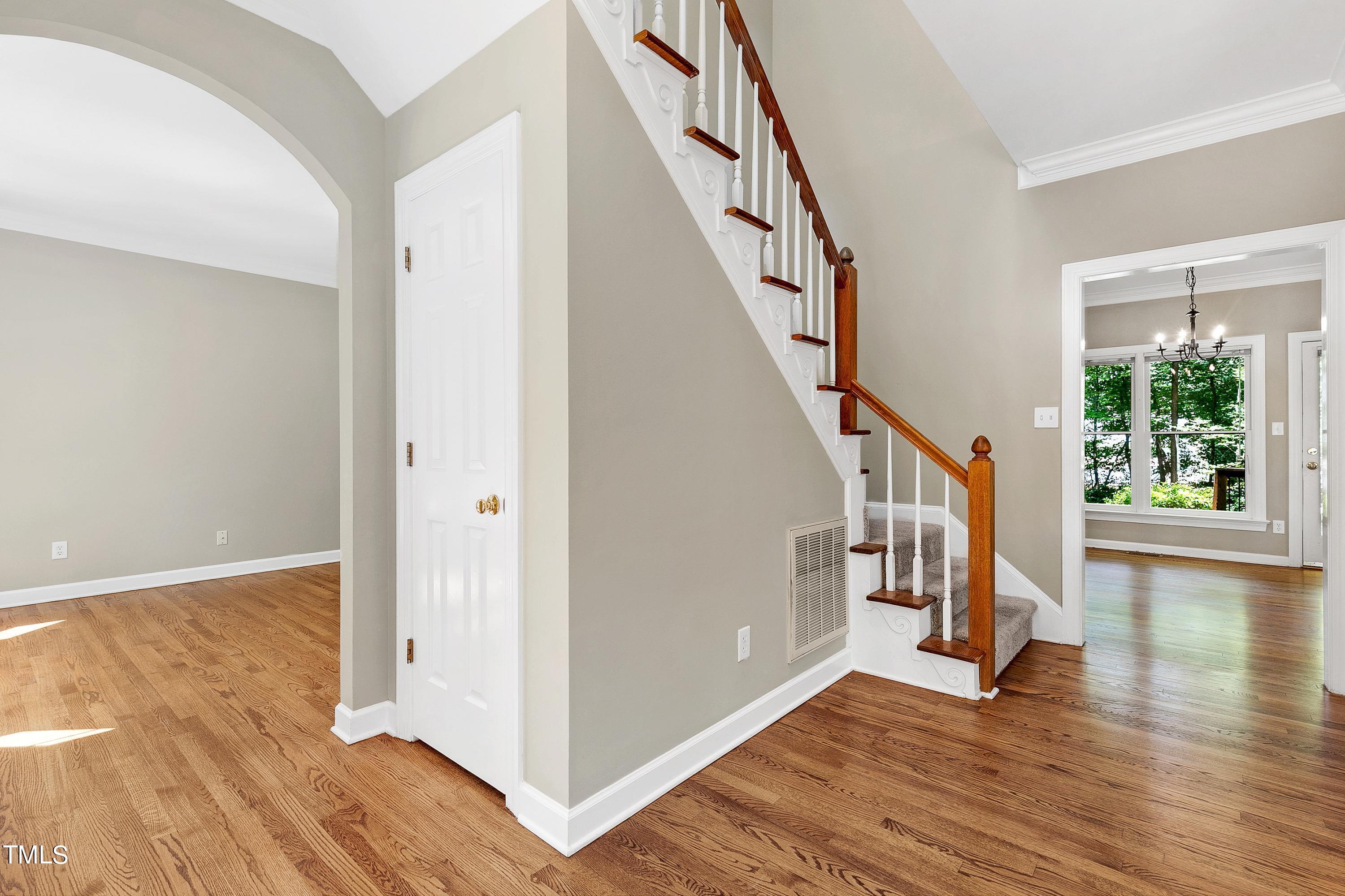100 Buckden Place Cary, NC 27518 - Photo 4 of 70 a view of an entryway with wooden floor windows and a livingroom