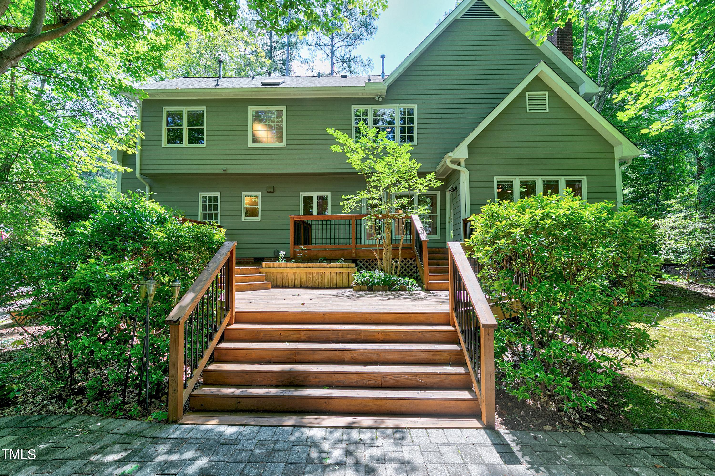 100 Buckden Place Cary, NC 27518 - Photo 44 of 70 a front view of a house with plants