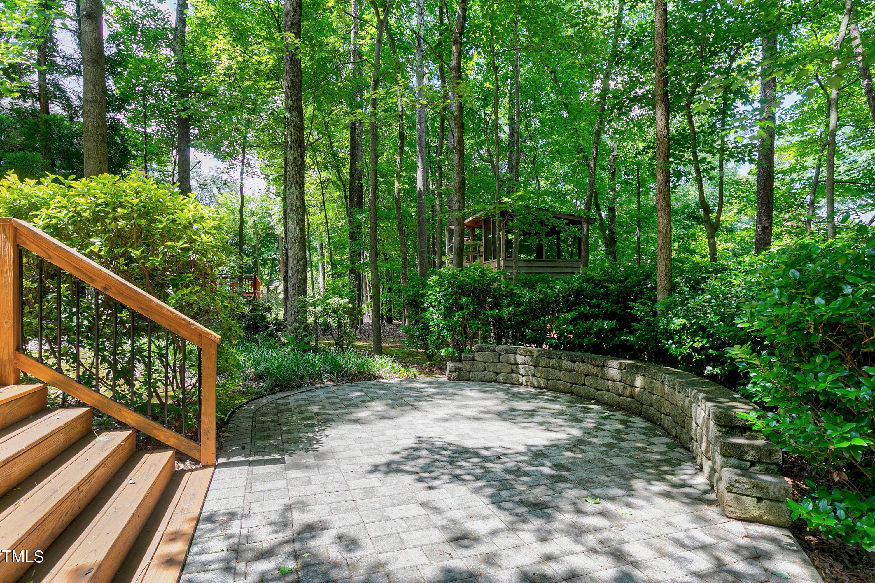 100 Buckden Place Cary, NC 27518 - Photo 48 of 70 a view of a pathway of a park with large trees