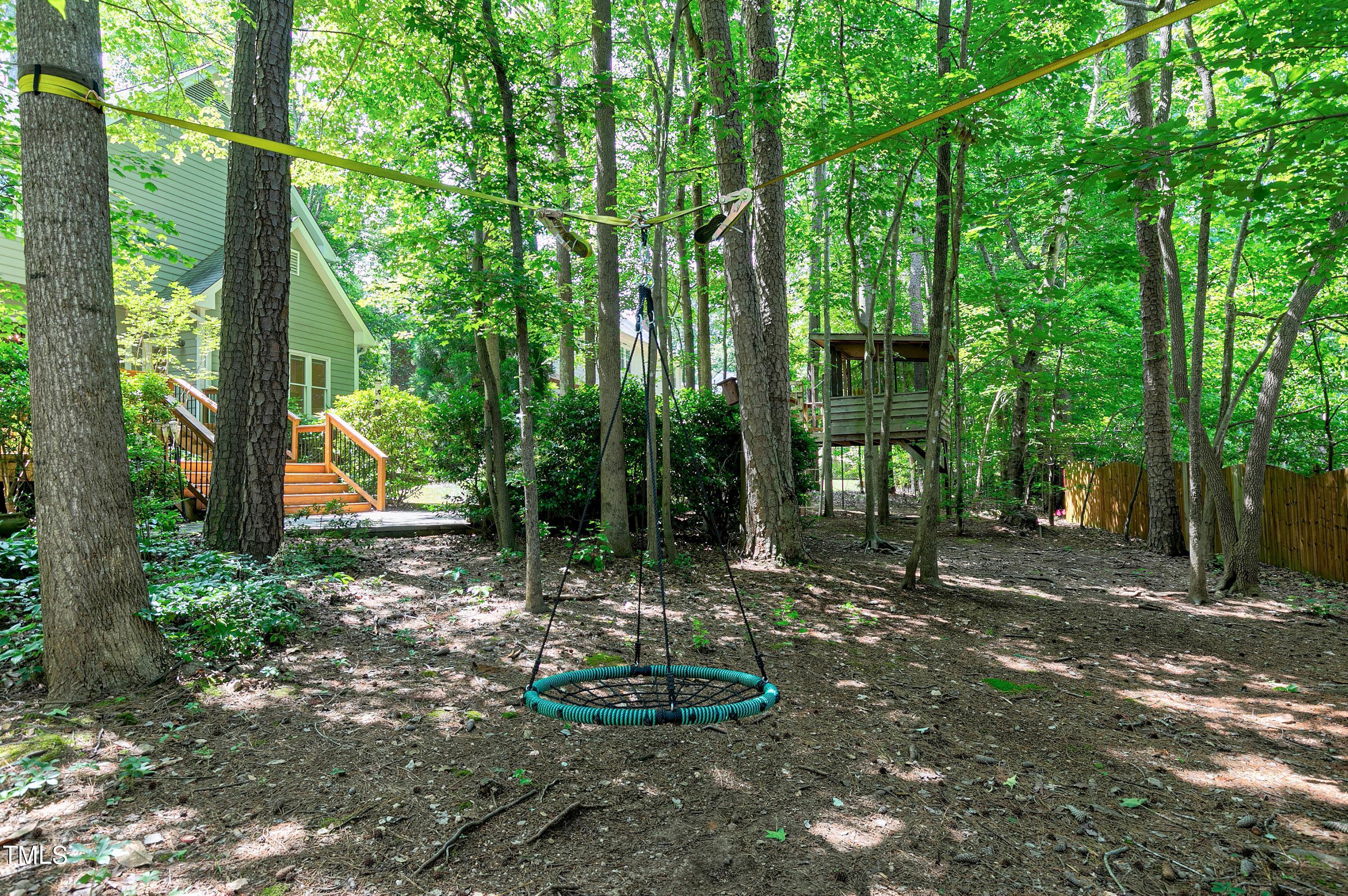 100 Buckden Place Cary, NC 27518 - Photo 51 of 70 a backyard of a house with lots of green space