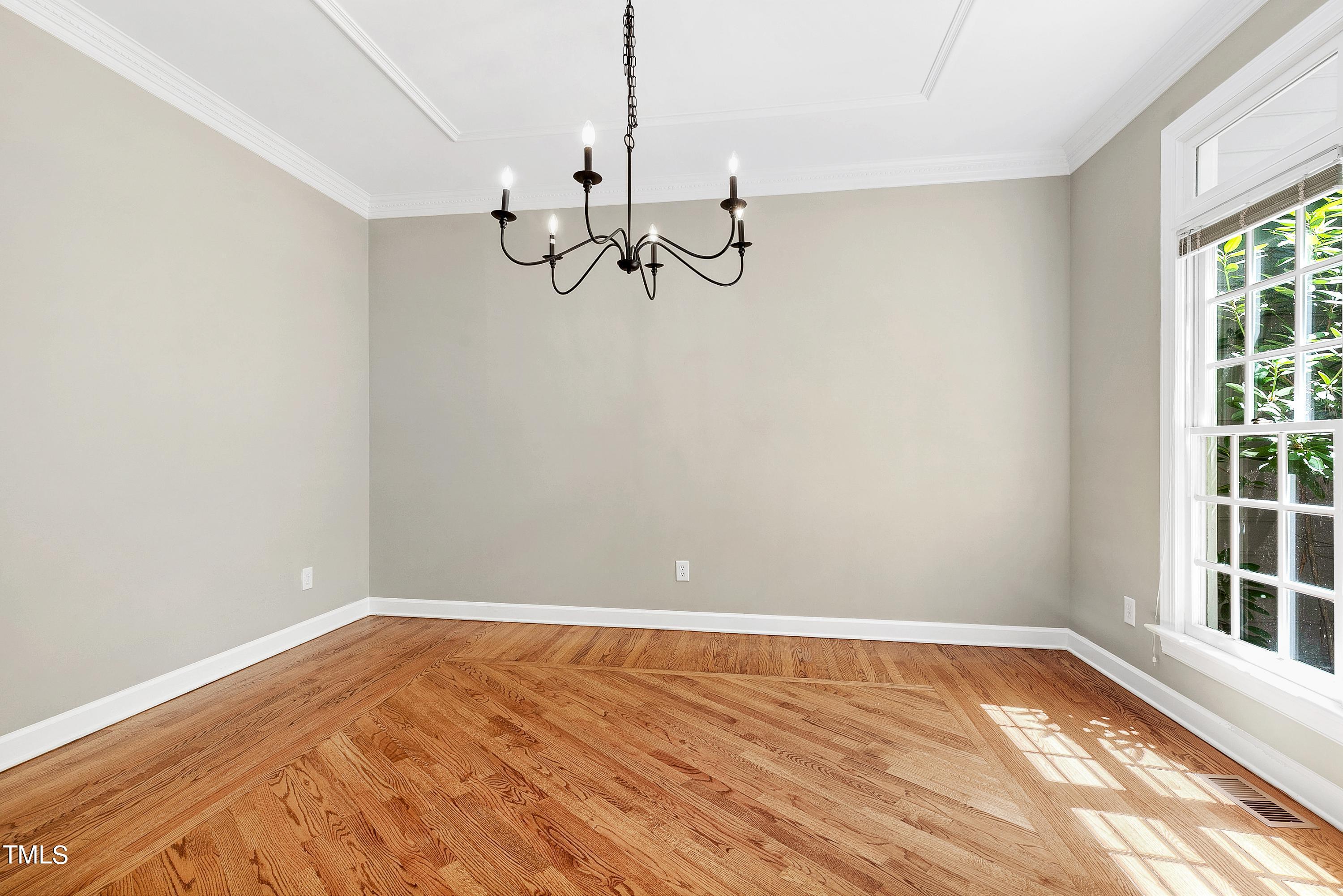 100 Buckden Place Cary, NC 27518 - Photo 6 of 70 a view of a room with a window and wooden floor