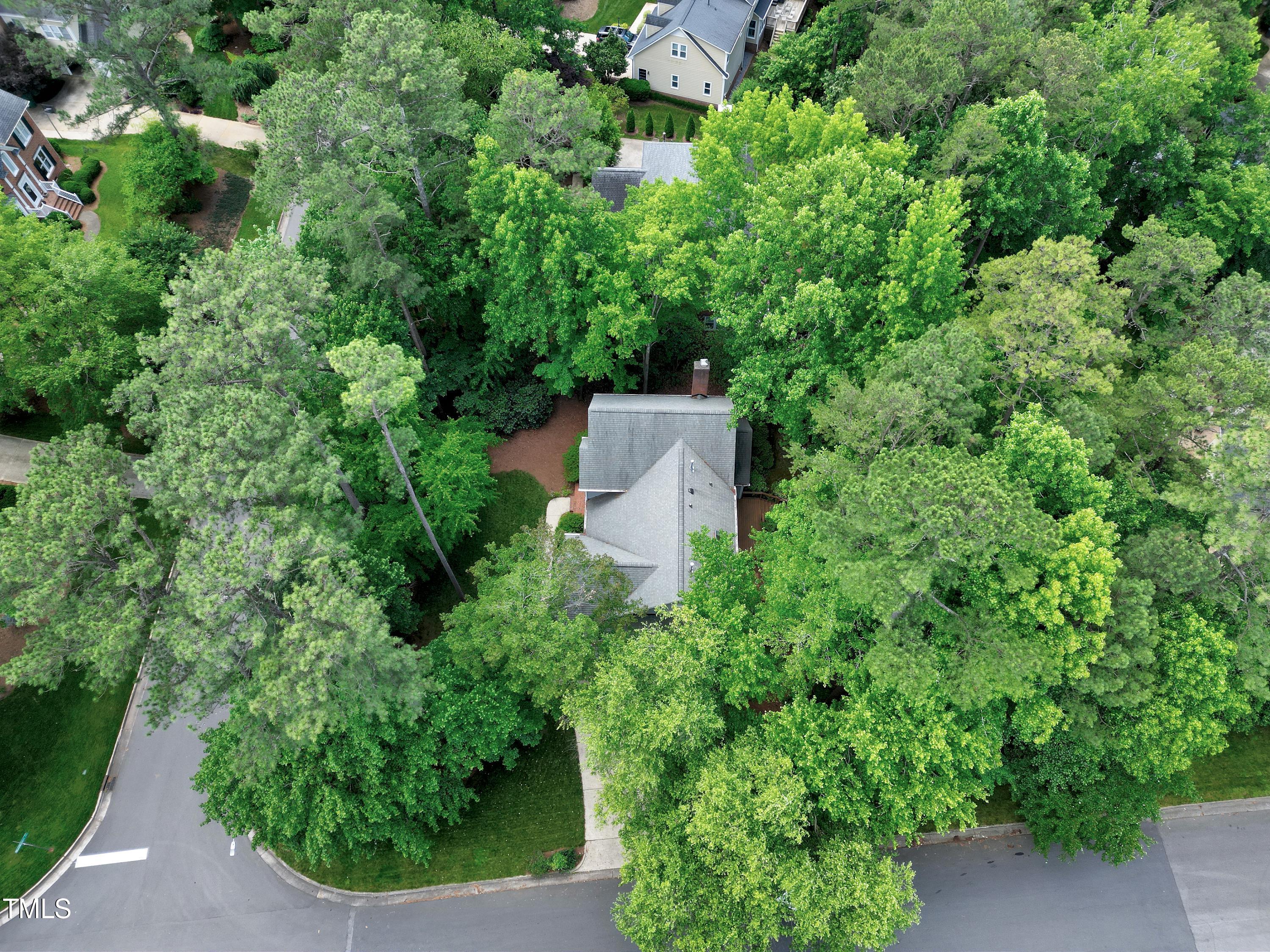 100 Buckden Place Cary, NC 27518 - Photo 65 of 70 an aerial view of a house with a yard and outdoor seating