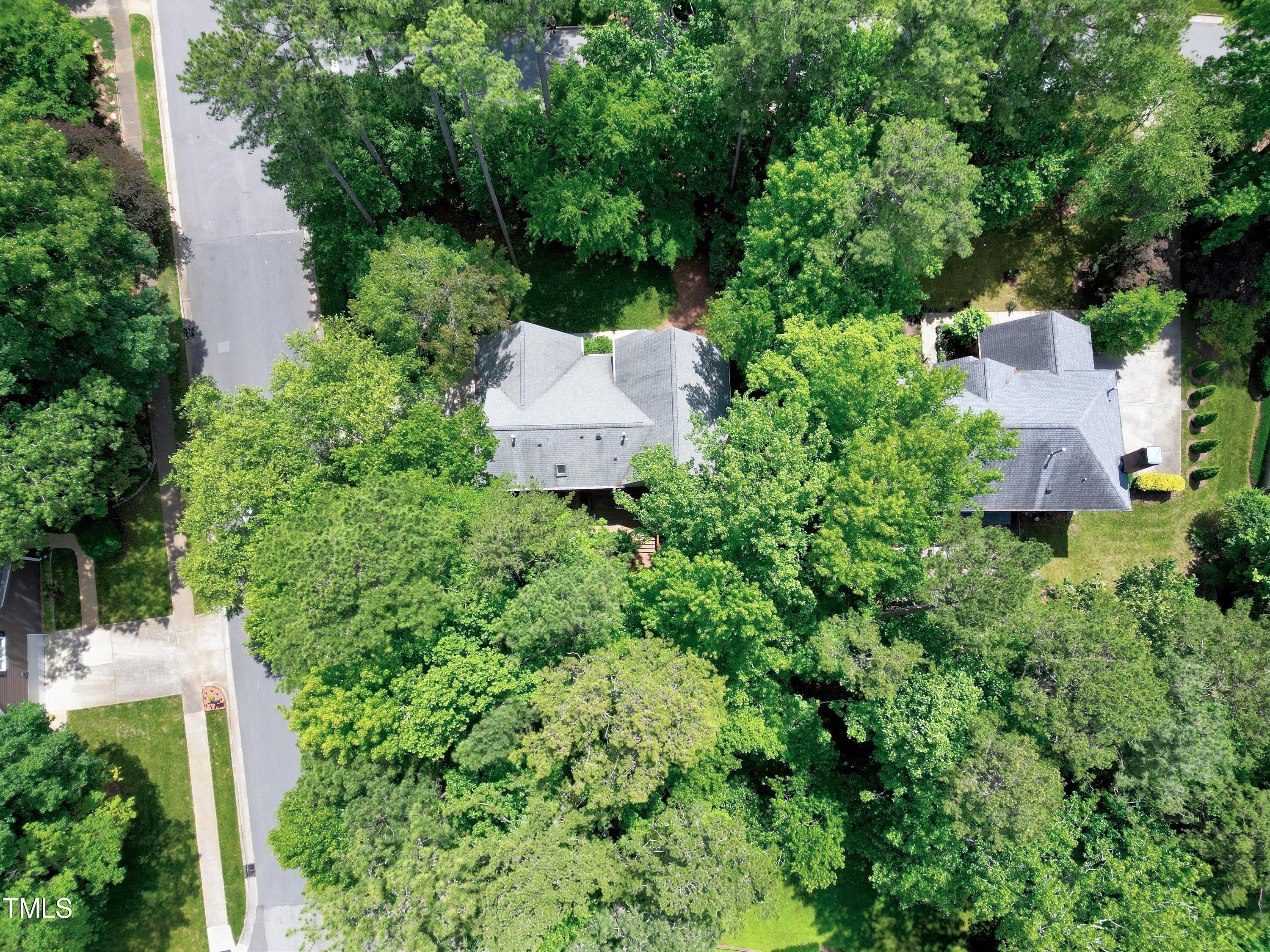 100 Buckden Place Cary, NC 27518 - Photo 67 of 70 an aerial view of a house with pool outdoor seating and trees