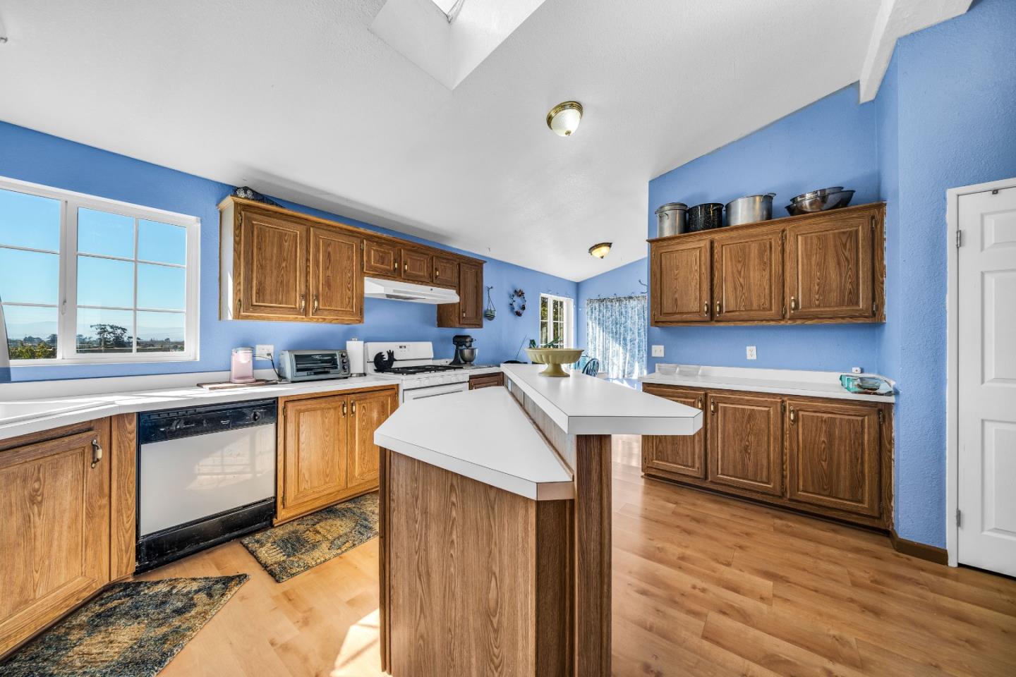 8645 Archer Road Salinas, CA 93907 - Photo 15 of 60 a kitchen with stainless steel appliances granite countertop wooden cabinets sink and stove top oven