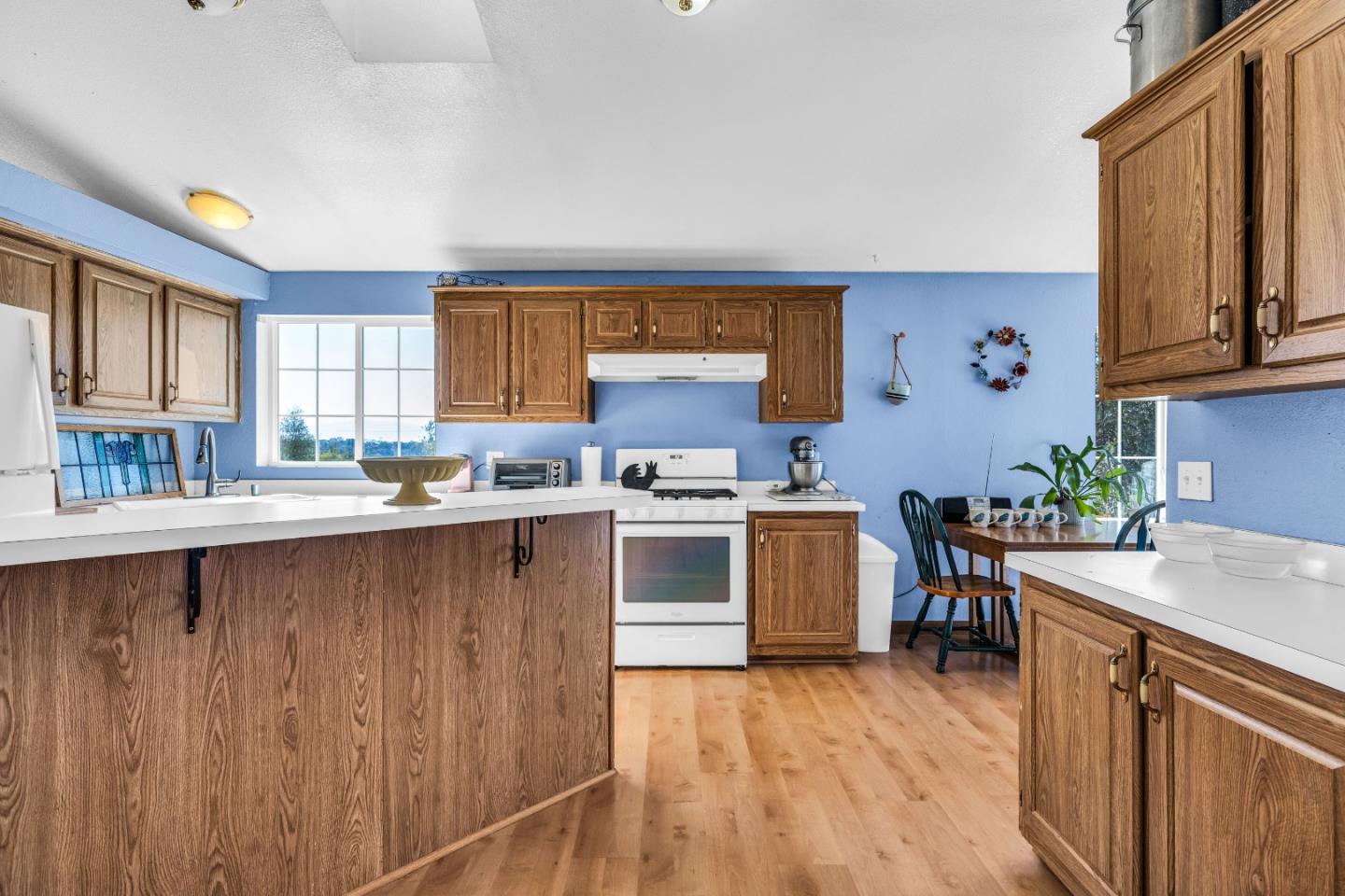 8645 Archer Road Salinas, CA 93907 - Photo 19 of 60 a kitchen with granite countertop a sink cabinets and stainless steel appliances