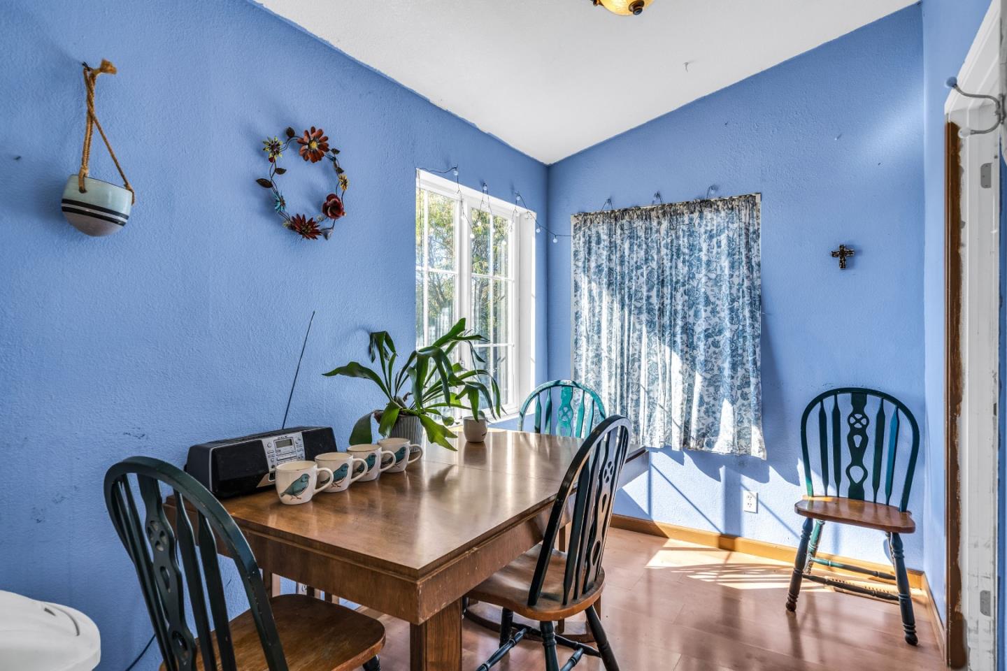 8645 Archer Road Salinas, CA 93907 - Photo 20 of 60 a dining room with furniture potted plants and wooden floor