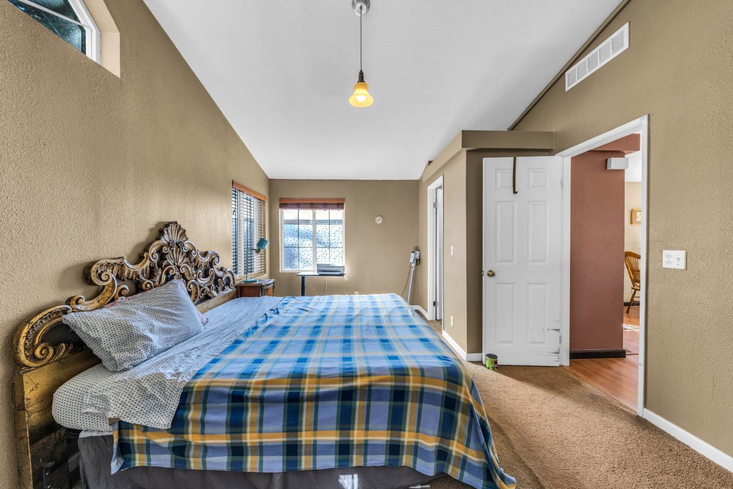 8645 Archer Road Salinas, CA 93907 - Photo 23 of 60 a bedroom with a bed and wooden floor
