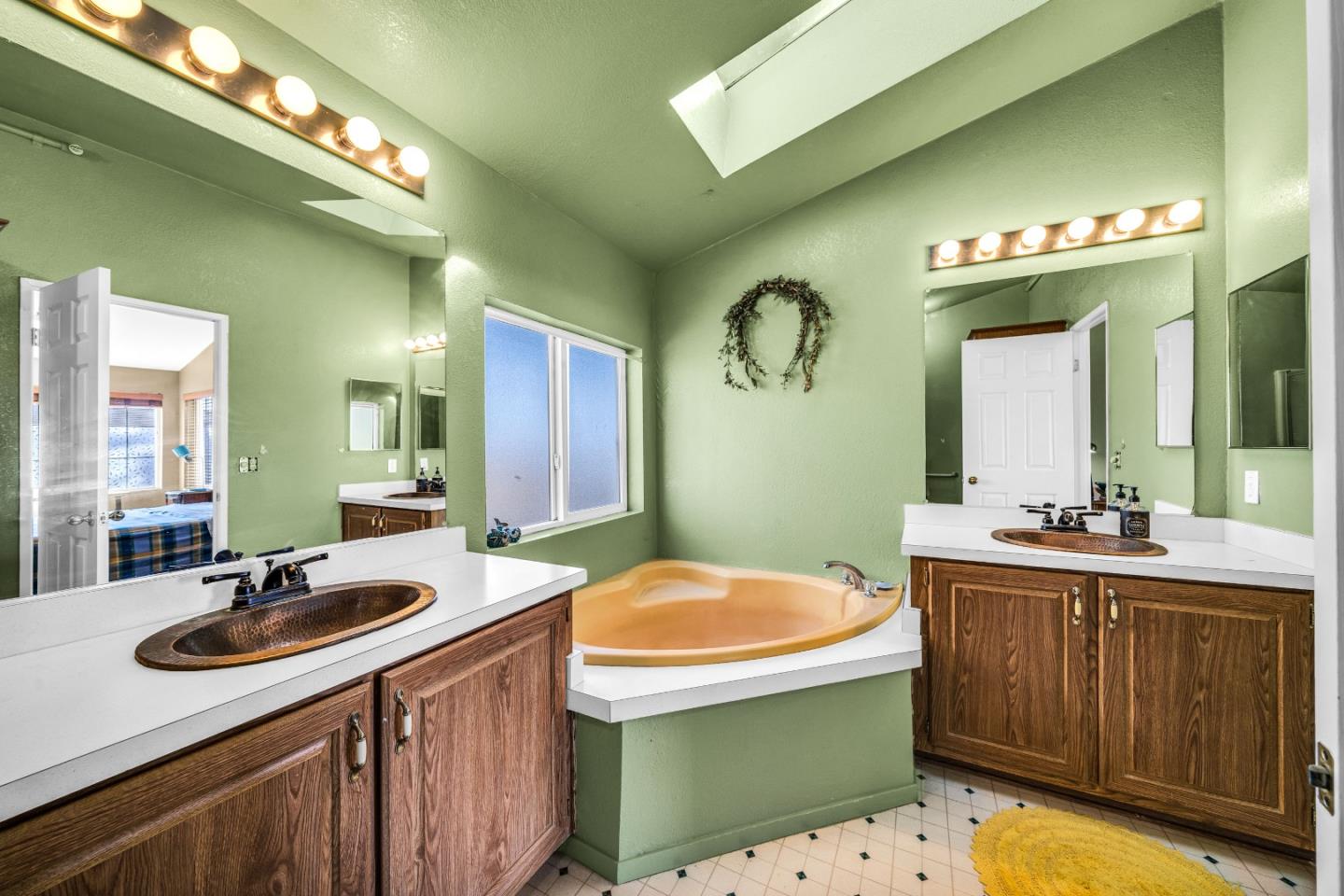 8645 Archer Road Salinas, CA 93907 - Photo 28 of 60 a bathroom with a sink and a mirror