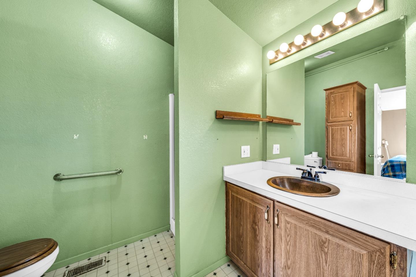 8645 Archer Road Salinas, CA 93907 - Photo 29 of 60 a bathroom with a sink and a mirror