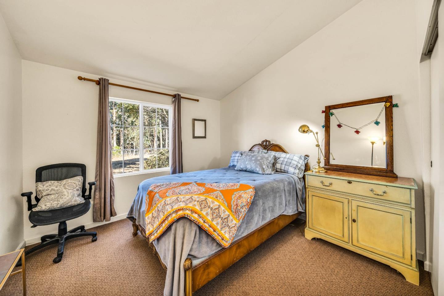 8645 Archer Road Salinas, CA 93907 - Photo 30 of 60 a bedroom with a bed and windows