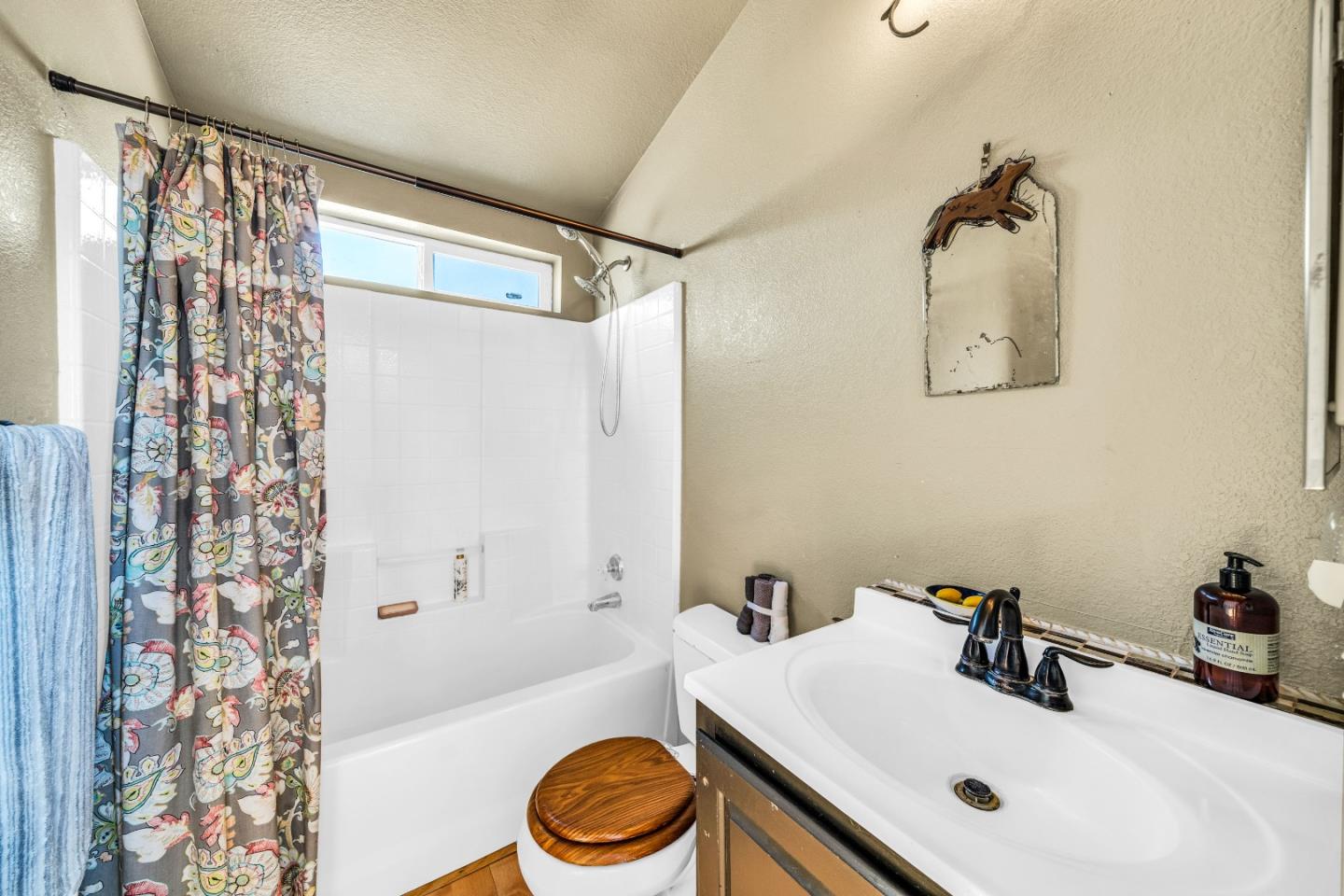 8645 Archer Road Salinas, CA 93907 - Photo 34 of 60 a bathroom with a sink a toilet and shower