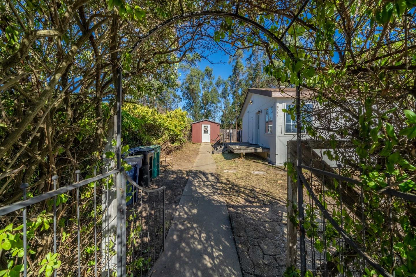 8645 Archer Road Salinas, CA 93907 - Photo 4 of 60 a view of a yard with wooden fence