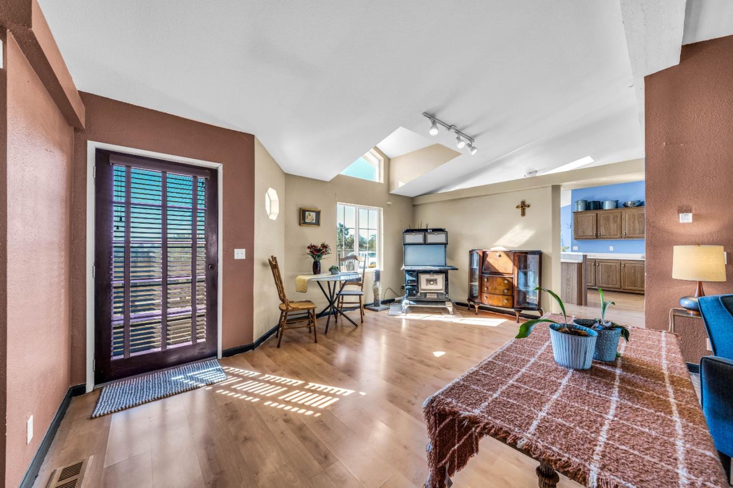 8645 Archer Road Salinas, CA 93907 - Photo 10 of 60 a living room with furniture a wooden floor and next to a window