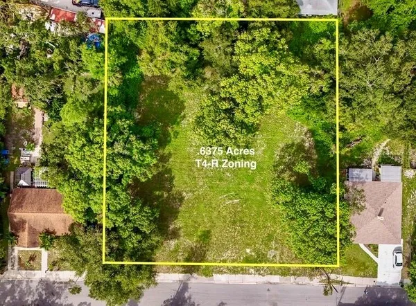 a view of a field with an outdoor space