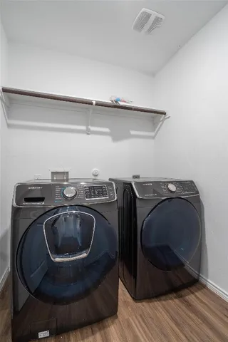 a utility room with sink washer and dryer