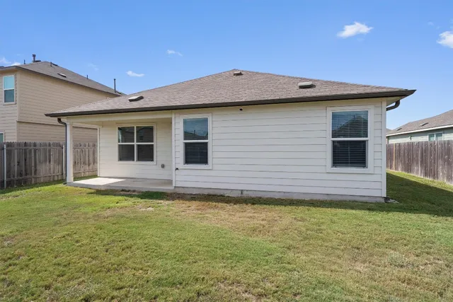 a view of a backyard with a garden and plants