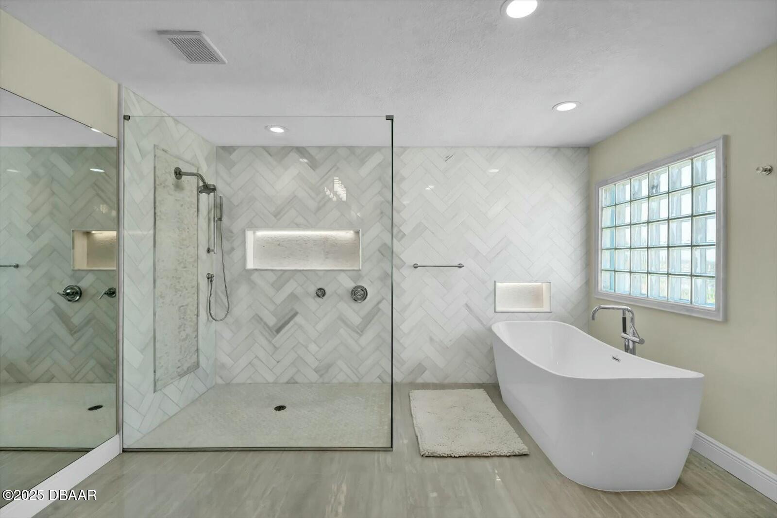 4363 South Atlantic Avenue Ponce Inlet, FL 32127 - Photo 17 of 46 a bathroom with a bathtub and shower