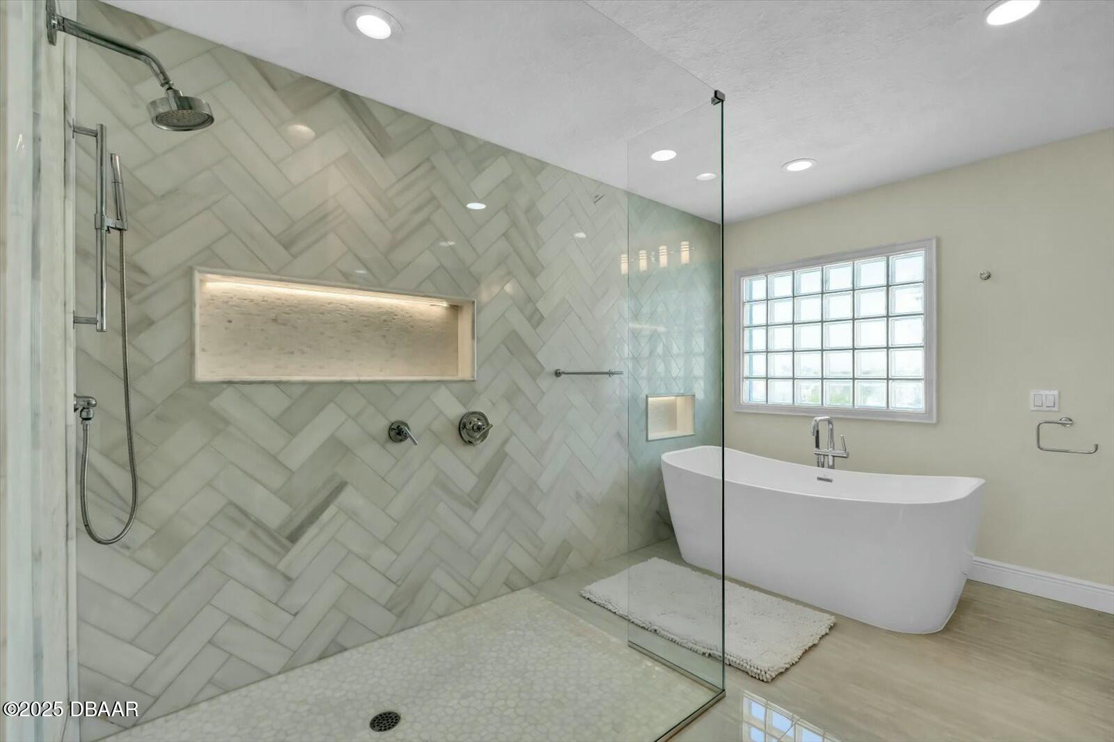 4363 South Atlantic Avenue Ponce Inlet, FL 32127 - Photo 18 of 46 a spacious bathroom with a bathtub and shower