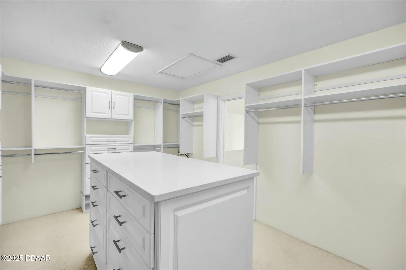 4363 South Atlantic Avenue Ponce Inlet, FL 32127 - Photo 21 of 46 a kitchen with a sink and a refrigerator