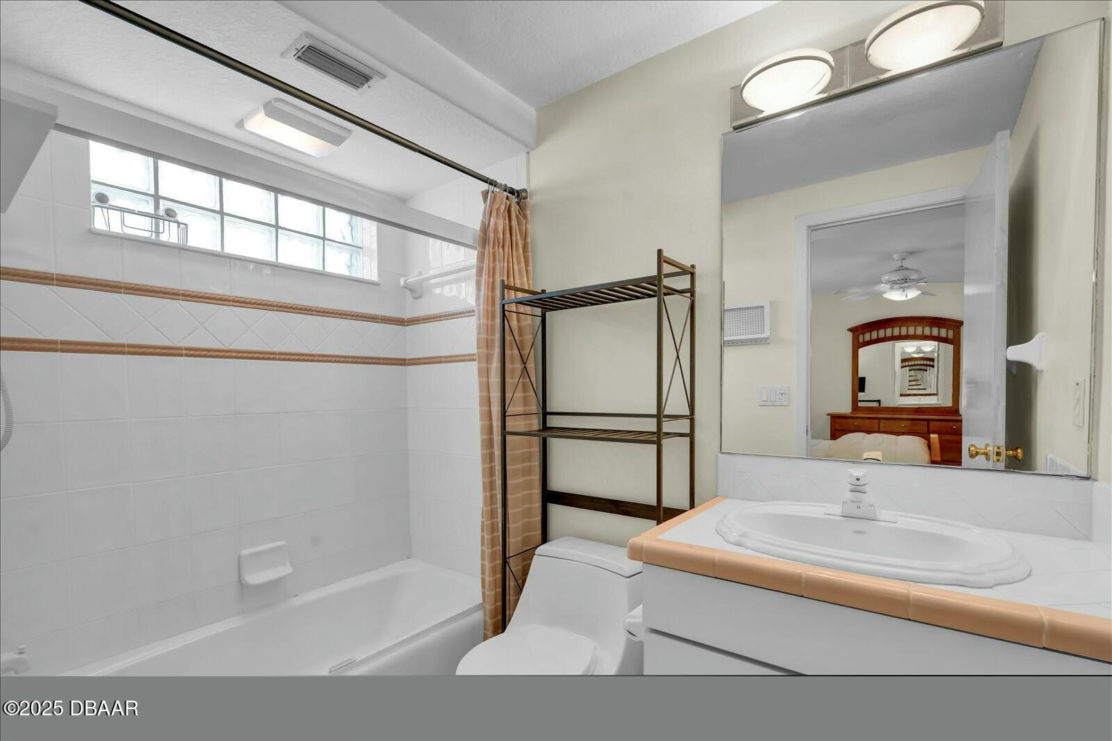 4363 South Atlantic Avenue Ponce Inlet, FL 32127 - Photo 25 of 46 a bathroom with a tub and a mirror