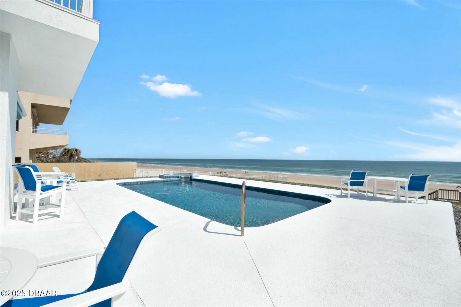 4363 South Atlantic Avenue Ponce Inlet, FL 32127 - Photo 3 of 46 a kitchen with a table chairs and utility