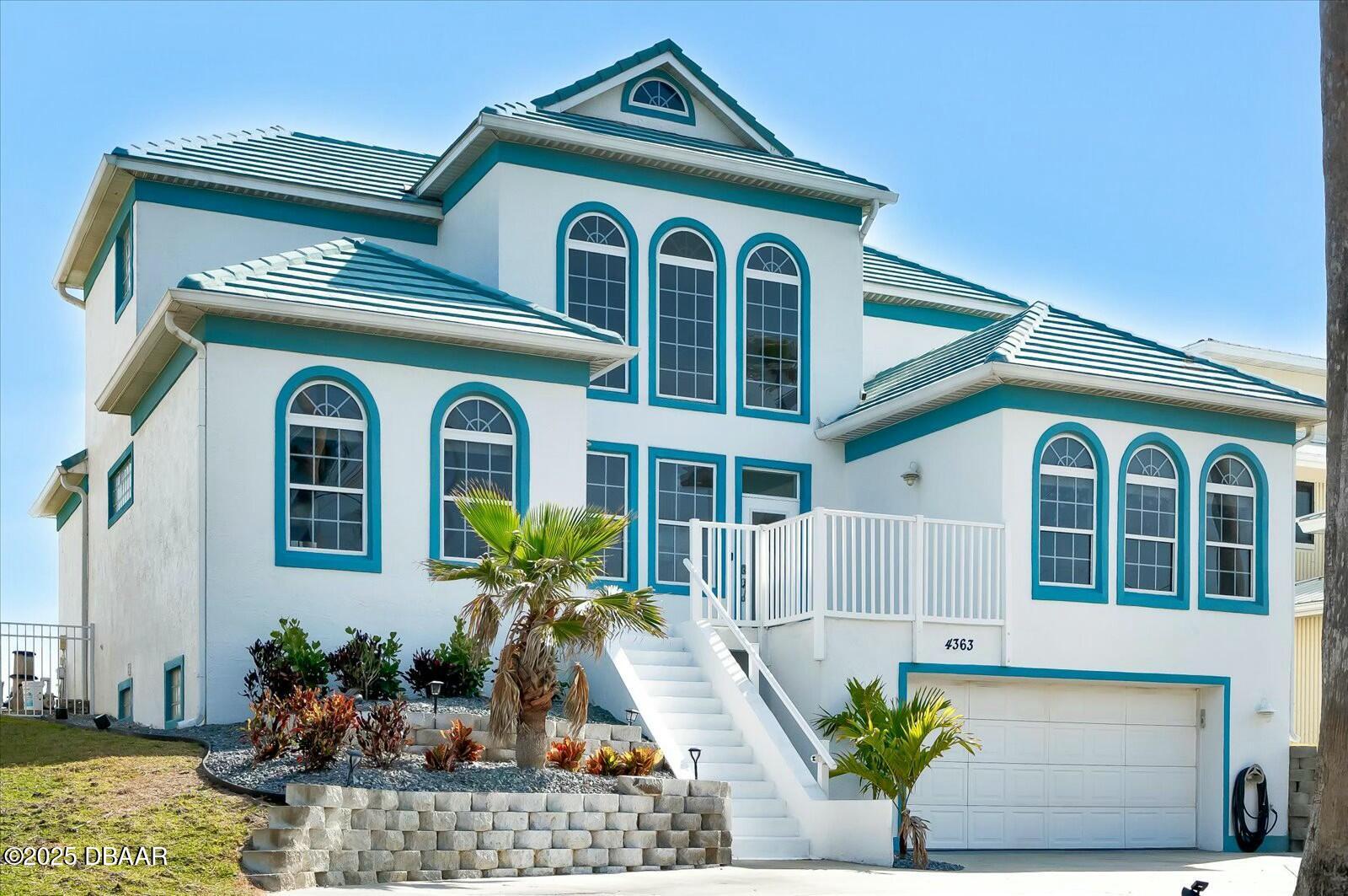 4363 South Atlantic Avenue Ponce Inlet, FL 32127 - Photo 31 of 46 a front view of a house with plants