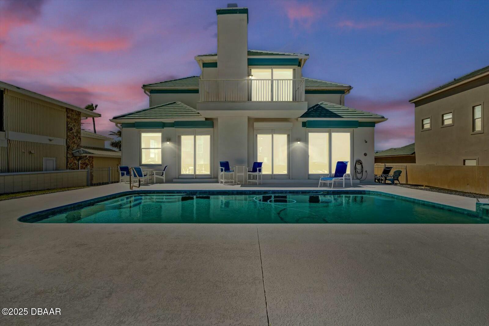 4363 South Atlantic Avenue Ponce Inlet, FL 32127 - Photo 45 of 46 a front view of a house with a yard and potted plants