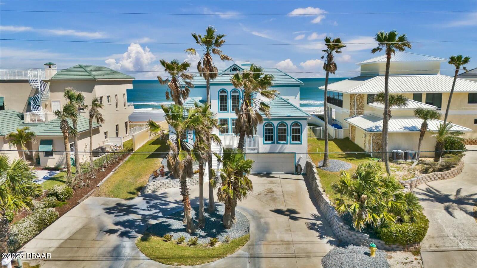 4363 South Atlantic Avenue Ponce Inlet, FL 32127 - Photo 5 of 46 a picture of a living room with a chandelier
