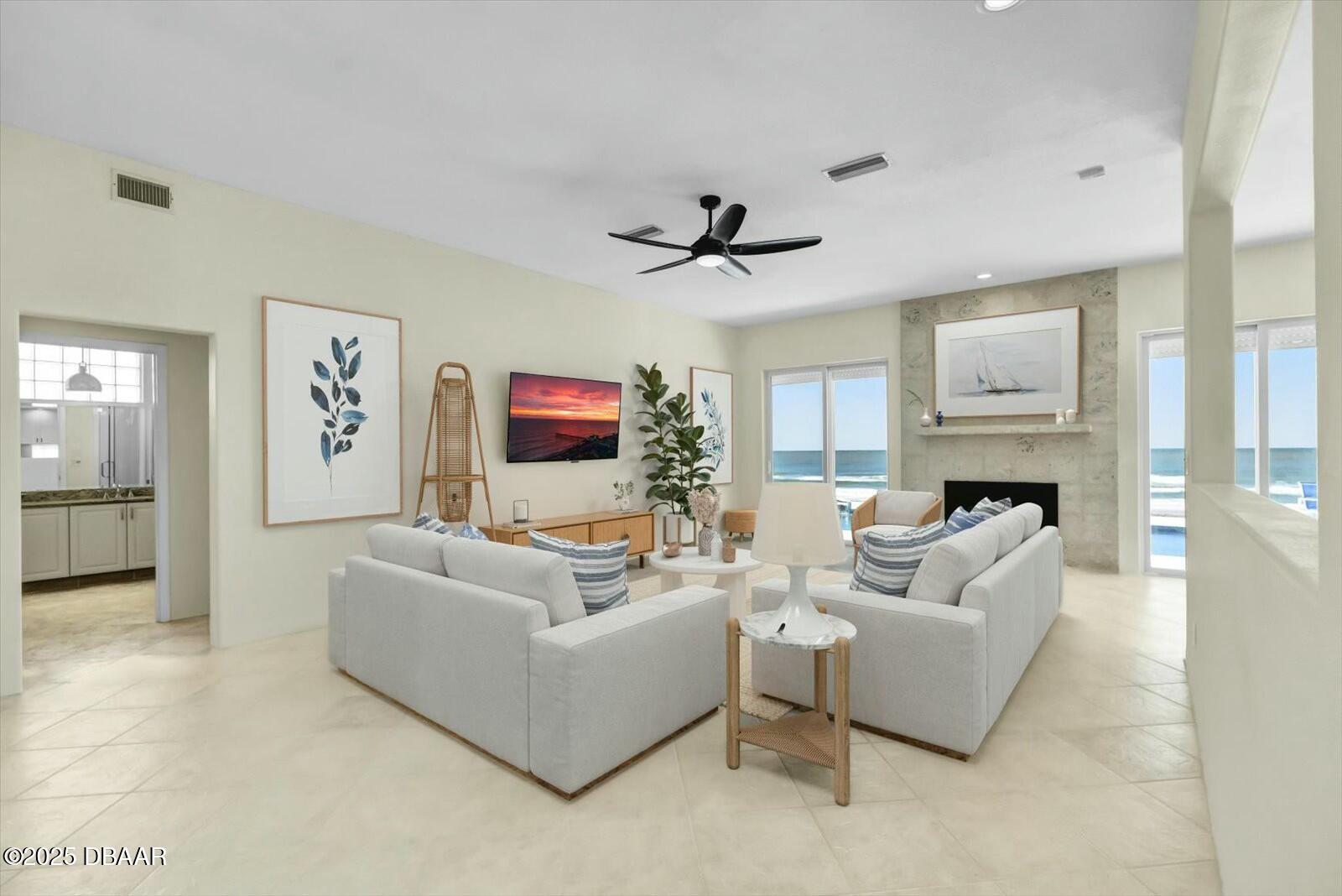 4363 South Atlantic Avenue Ponce Inlet, FL 32127 - Photo 9 of 46 a living room with furniture a fireplace and a flat screen tv