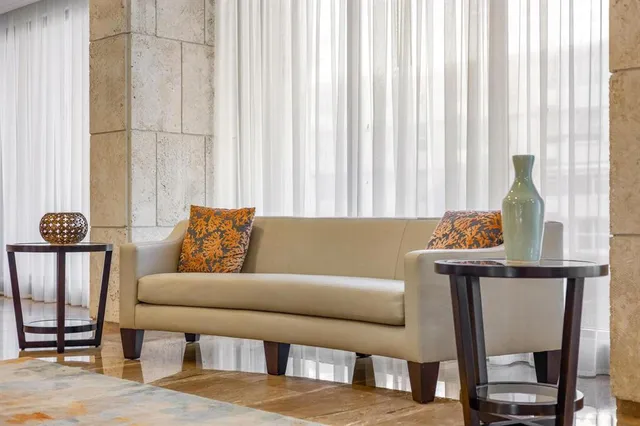 a living room with furniture and a window