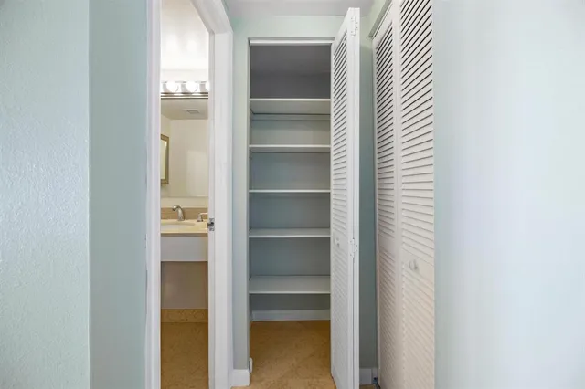 a view of a bedroom with a wardrobe space