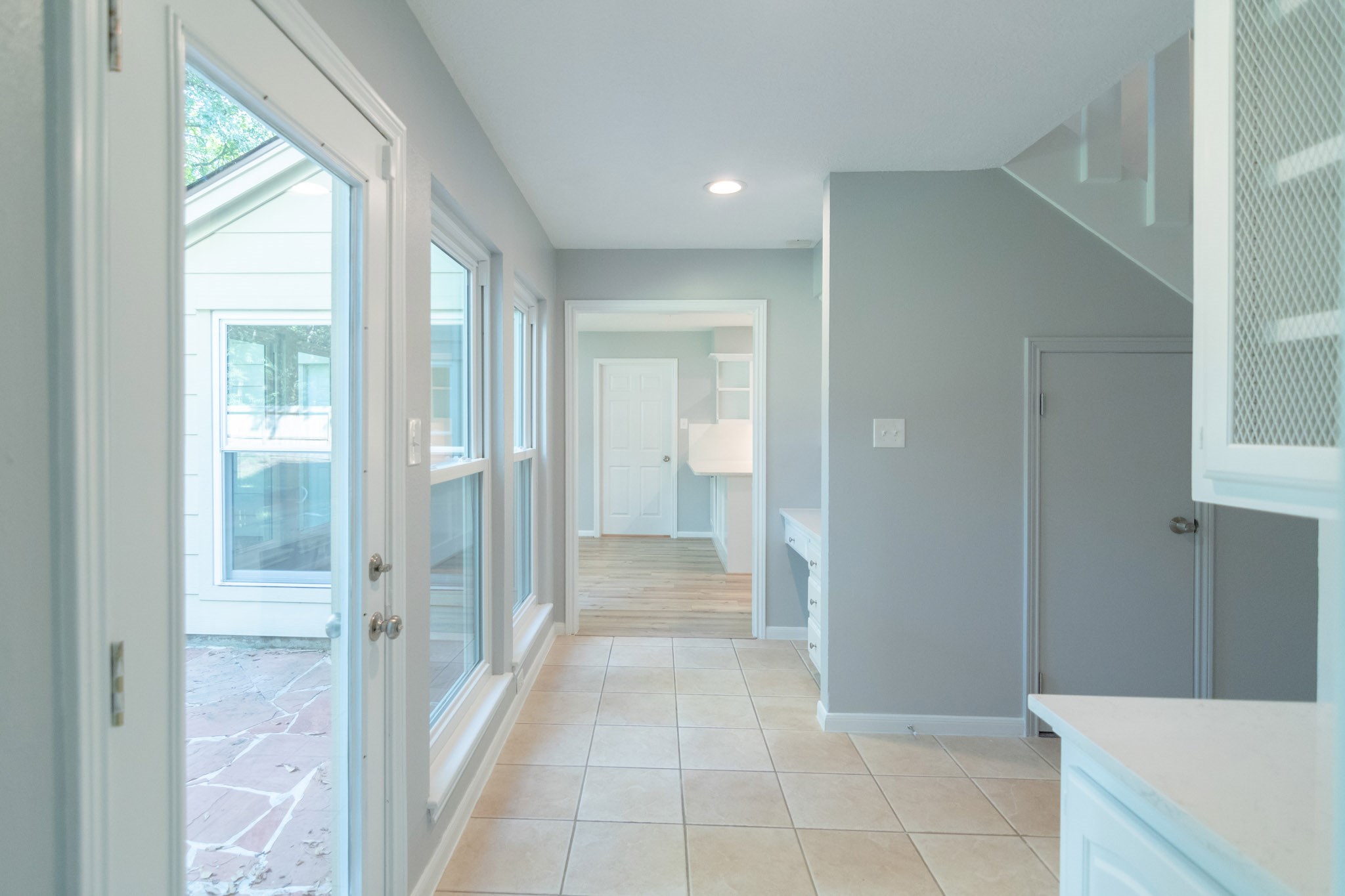 10 Coralvine Court Spring, TX 77380 - Photo 19 of 34 Glass doors and windows overlook flagstone patio and backyard.
