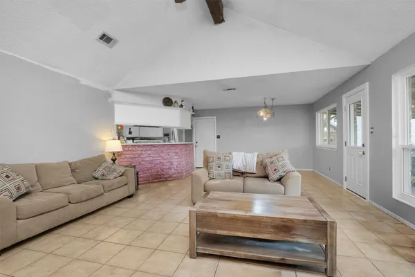 a living room with furniture and a couch