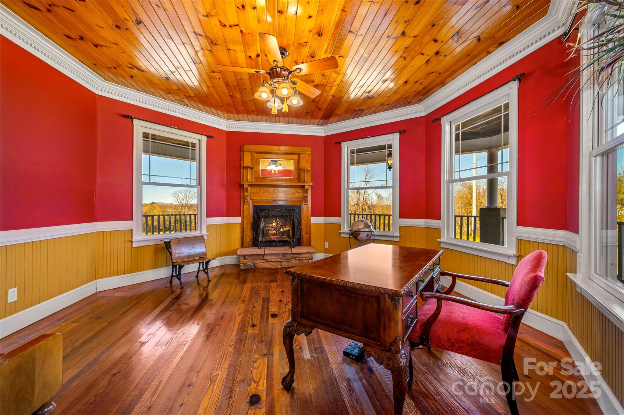 648 Harrill Dairy Road Forest City, NC 28043 - Photo 12 of 47 a dining room with furniture a fireplace and wooden floor