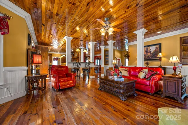 a large kitchen with lots of wooden cabinets and stainless steel appliances