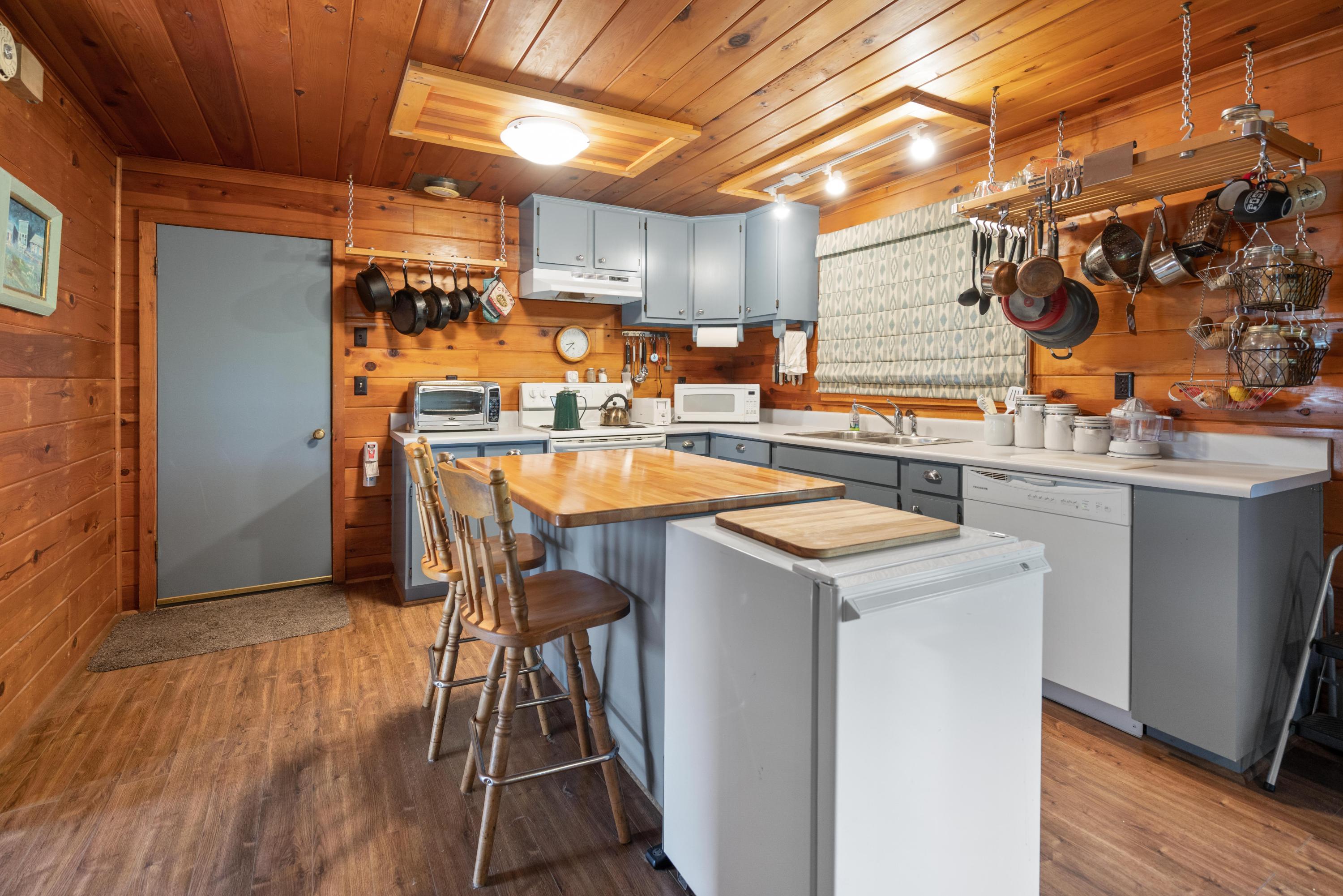 40 Lake Creek Lp Road Eagle Point, OR 97524 - Photo 26 of 70 a kitchen with a sink a stove and a refrigerator