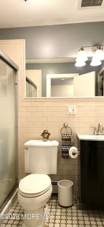 a bathroom with a toilet and a sink