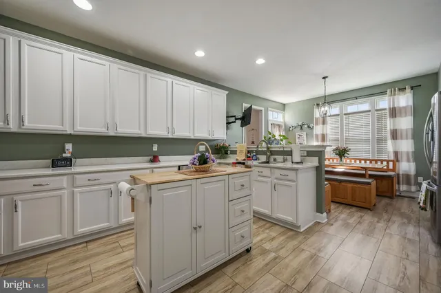 a kitchen with sink and cabinets