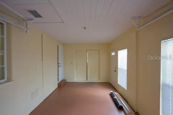 a view of a room with windows