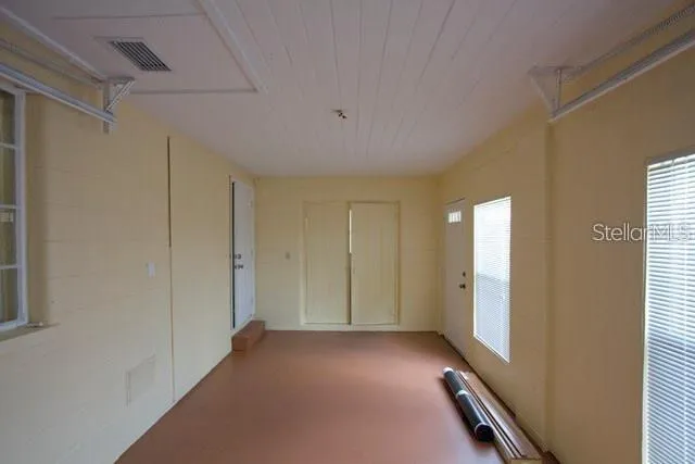 a view of a room with windows