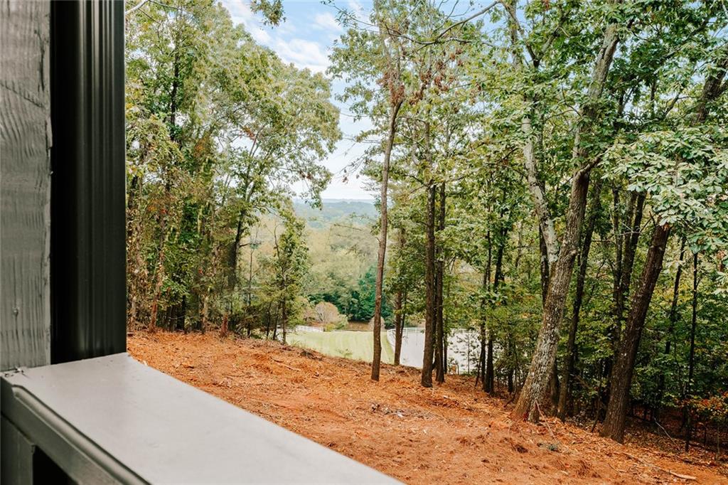 7820 Bethel Road Gainesville, GA 30506 - Photo 2 of 56 a view of a backyard of the house