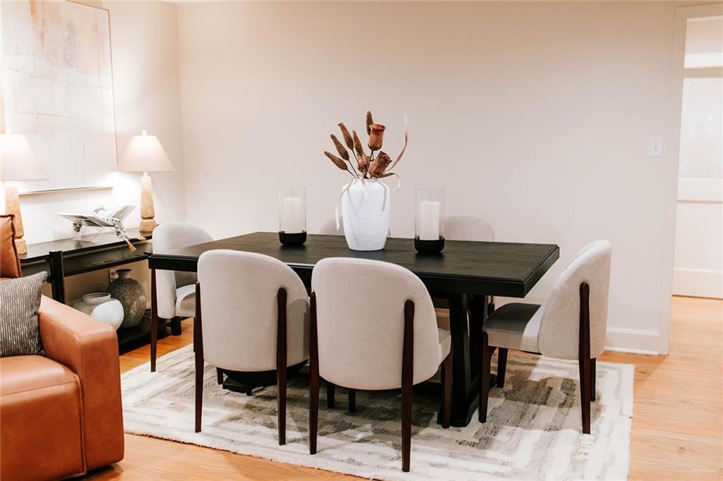 7820 Bethel Road Gainesville, GA 30506 - Photo 26 of 56 a dining room with furniture and a chandelier