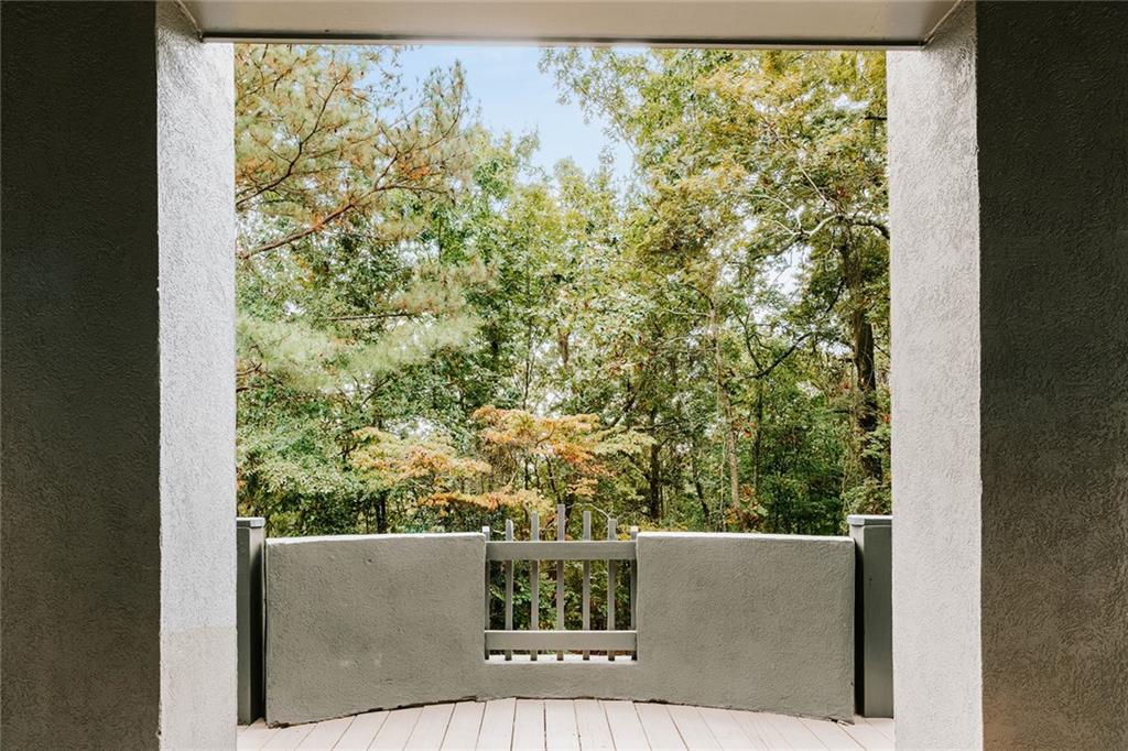 7820 Bethel Road Gainesville, GA 30506 - Photo 3 of 56 view of balcony with wooden floor