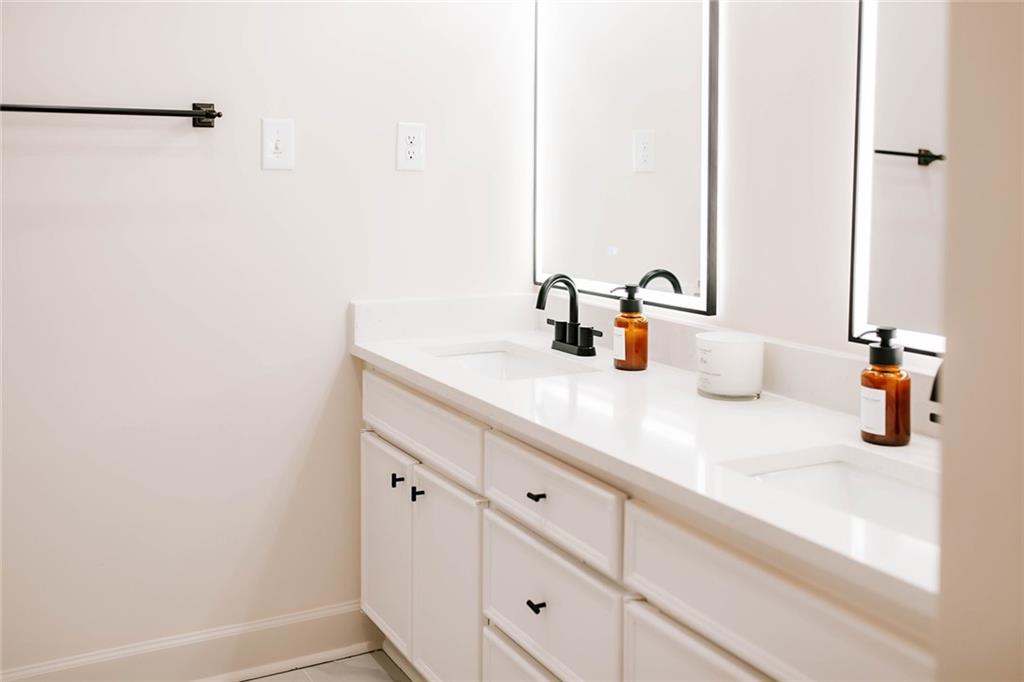 7820 Bethel Road Gainesville, GA 30506 - Photo 45 of 56 a bathroom with a sink and a mirror