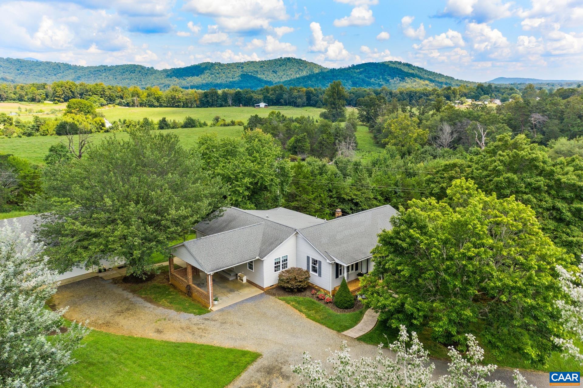 1640 Pea Ridge Road Stanardsville, VA 22973 - Photo 2 of 51 an aerial view of a house with yard and outdoor seating